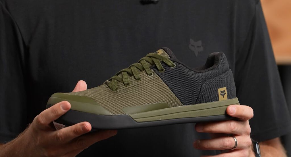 Person holding Fox Union Canvas shoe in green