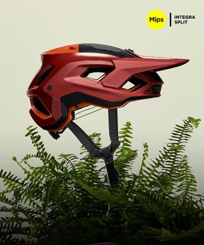 Speedframe bike helmet floating with vegetation in the back